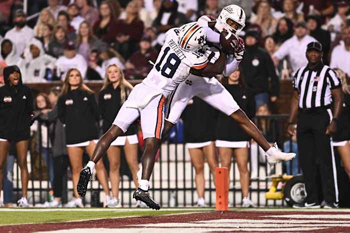 Nov 5, 2022; Starkville, Mississippi, USA; Mississippi State Bulldogs wide receiver Rara Thomas (0) makes a reception for a touchdown while defended by Auburn Tigers cornerback Nehemiah Pritchett (18) during the second quarter at Davis Wade Stadium at Scott Field. Mandatory Credit: Matt Bush-USA TODAY Sports
